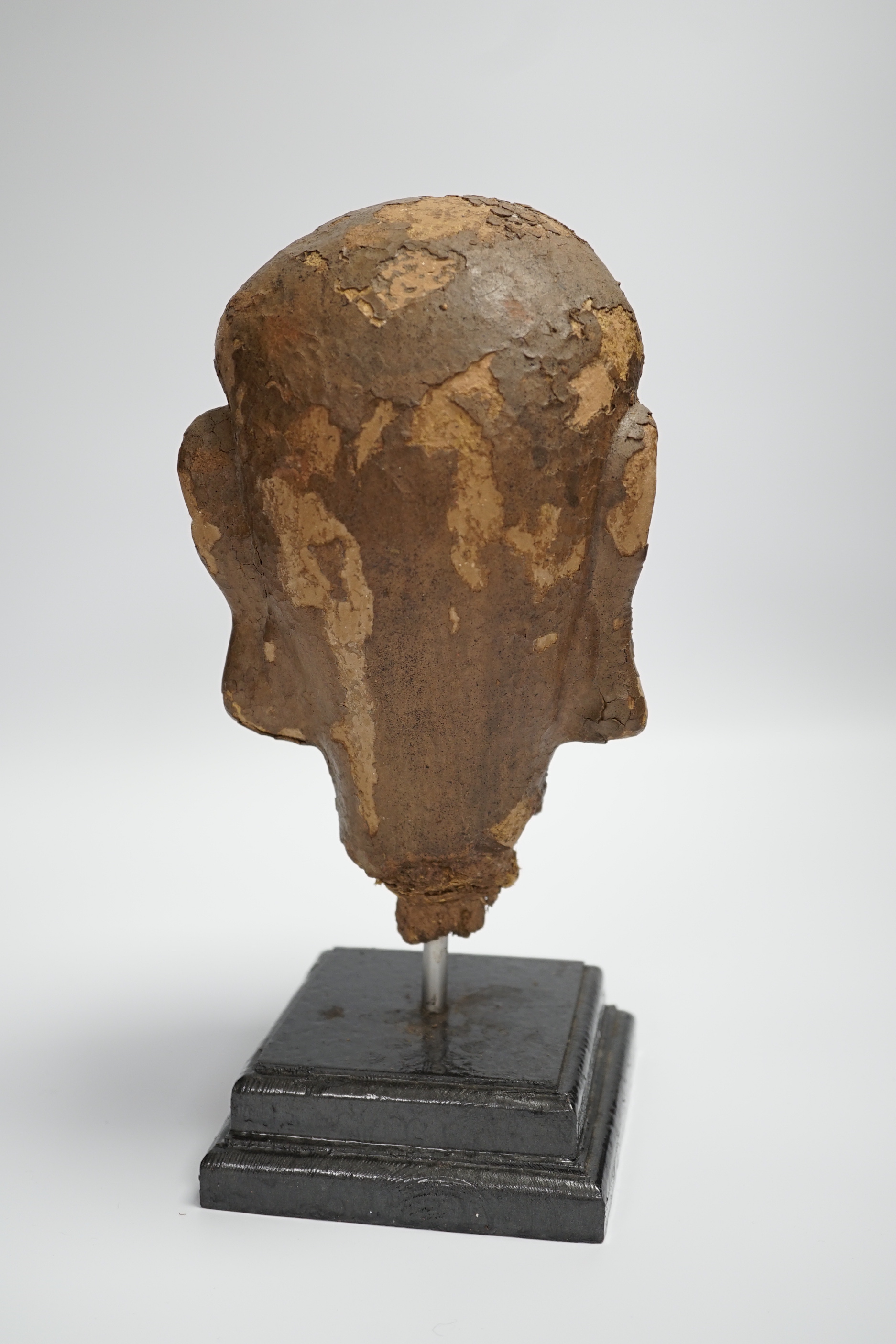 A Chinese lacquered clay head of a luohan, probably Ming dynasty, on stand, head 22cm high